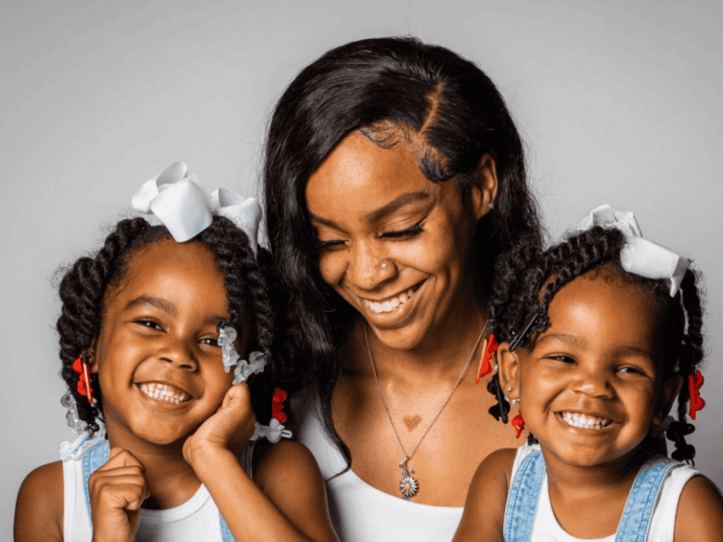 Padua National Family Celebration Happy mother with two smiling daughters at Padua National event.
